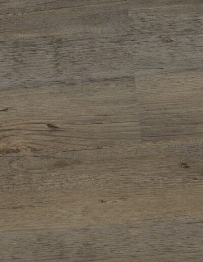 Moderner Vinylboden als 2,5 mm Klebeplanke in warmer Eichenoptik.